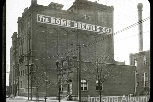 Historical exterior photograph of the Home Brewing Company at 24 South Shelby Street in Indianapolis, circa 1910, showing the original 1898 bottling house that today is the 24 Shelby industrial wedding venue.