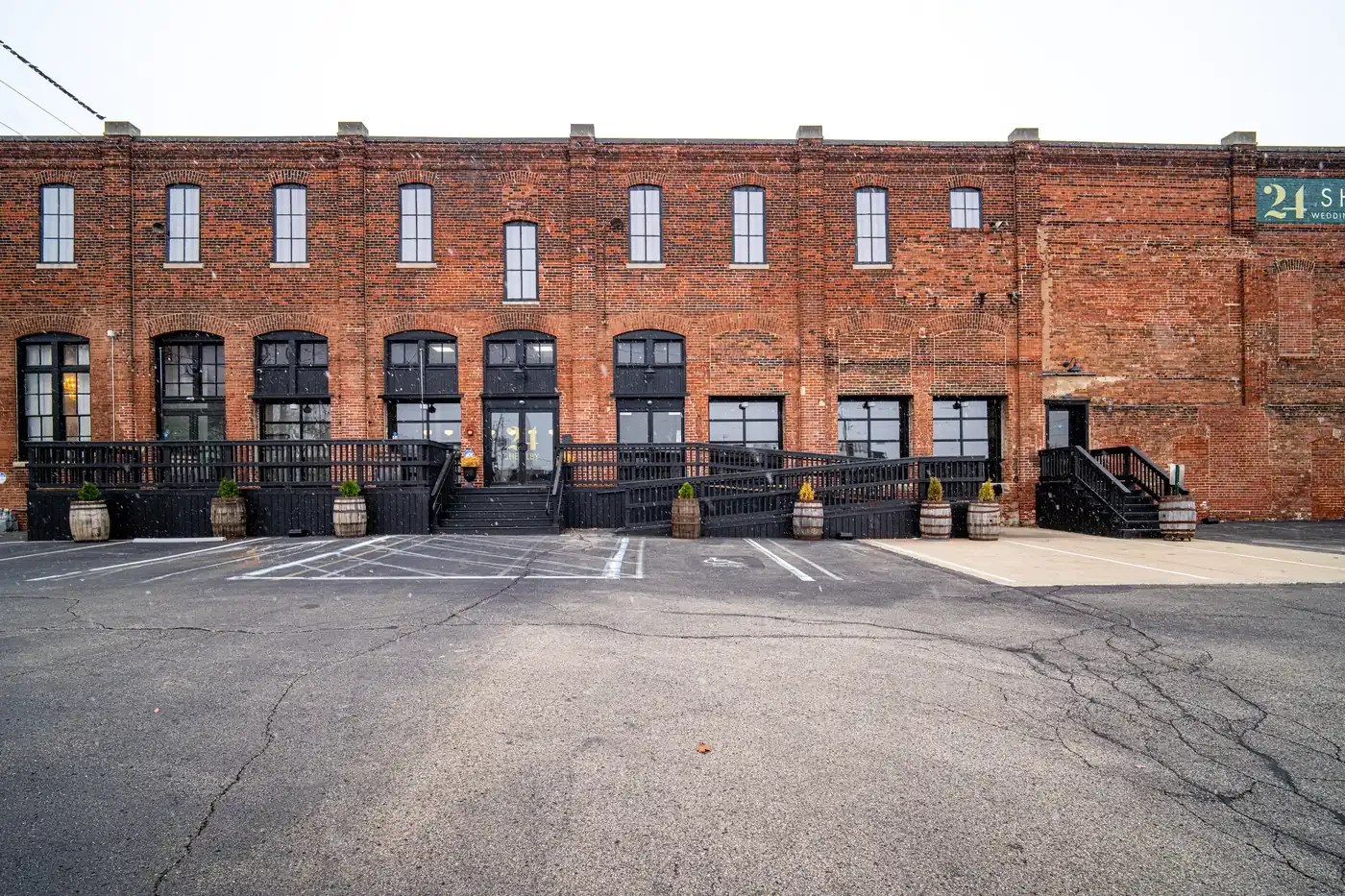The 1898 brick facade of 24 Shelby in downtown Indianapolis with its black deck and accessible ramp