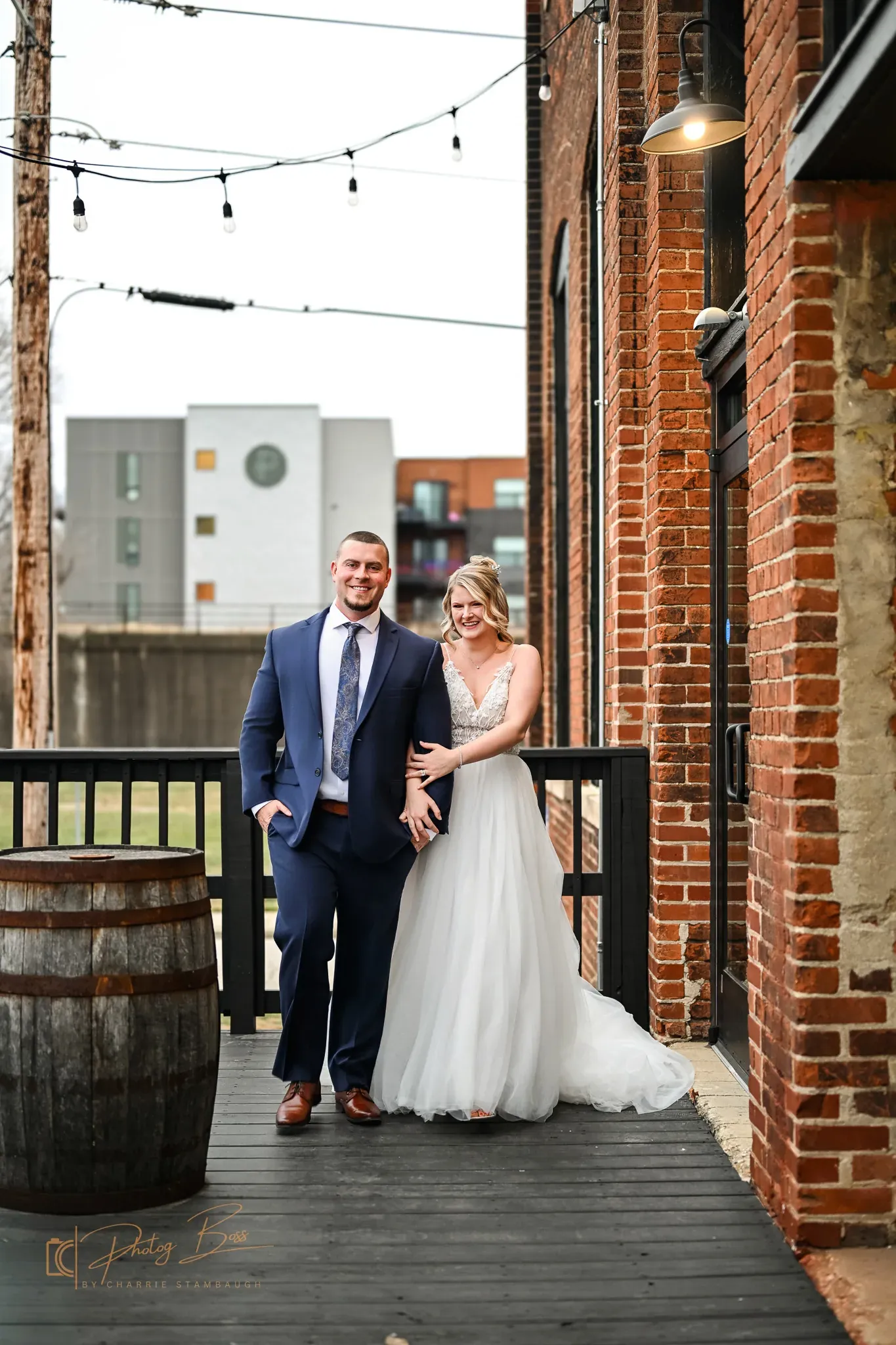 Couple on the Prohibition Patio at 24 Shelby, the downtown Indianapolis outdoor wedding venue with original brick walls and industrial windows.