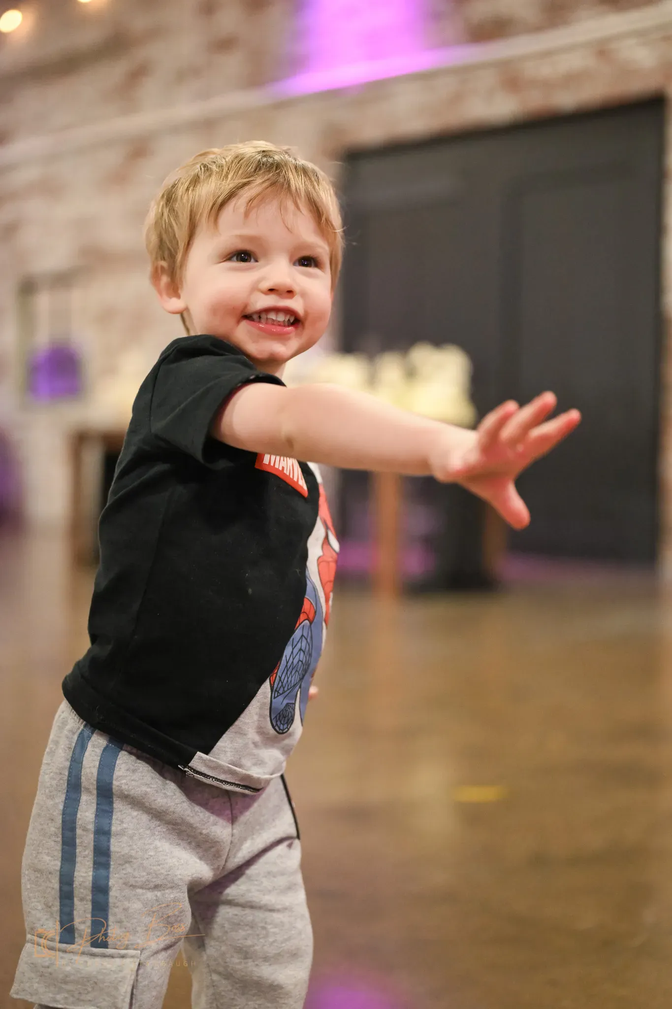 A child smiling at a family celebration, the kind of baby shower and family party an Indianapolis venue hosts