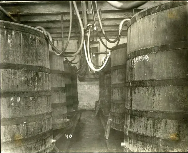 Wide interior of the 1898 bottling house at 24 Shelby in downtown Indianapolis with exposed brick walls and oversized factory windows.