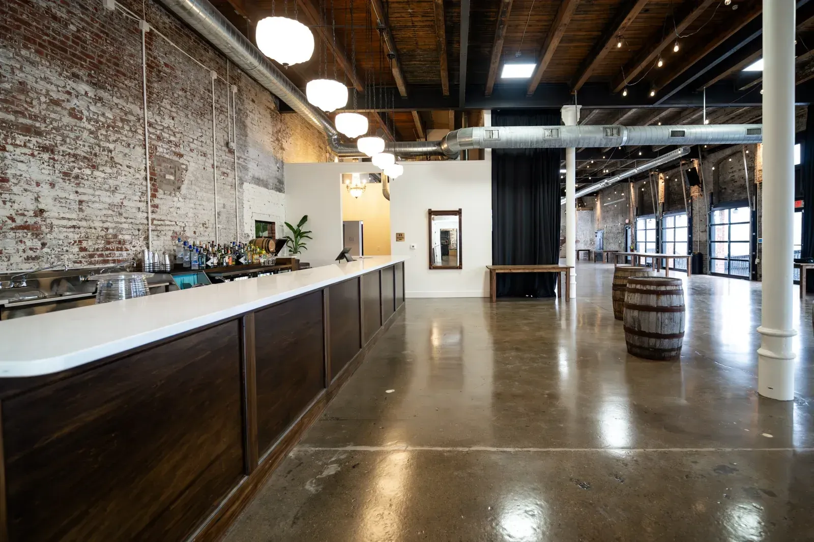 The marble-topped Libations Lounge bar at 24 Shelby running the length of the room, the in-house bar that serves every holiday party at the venue