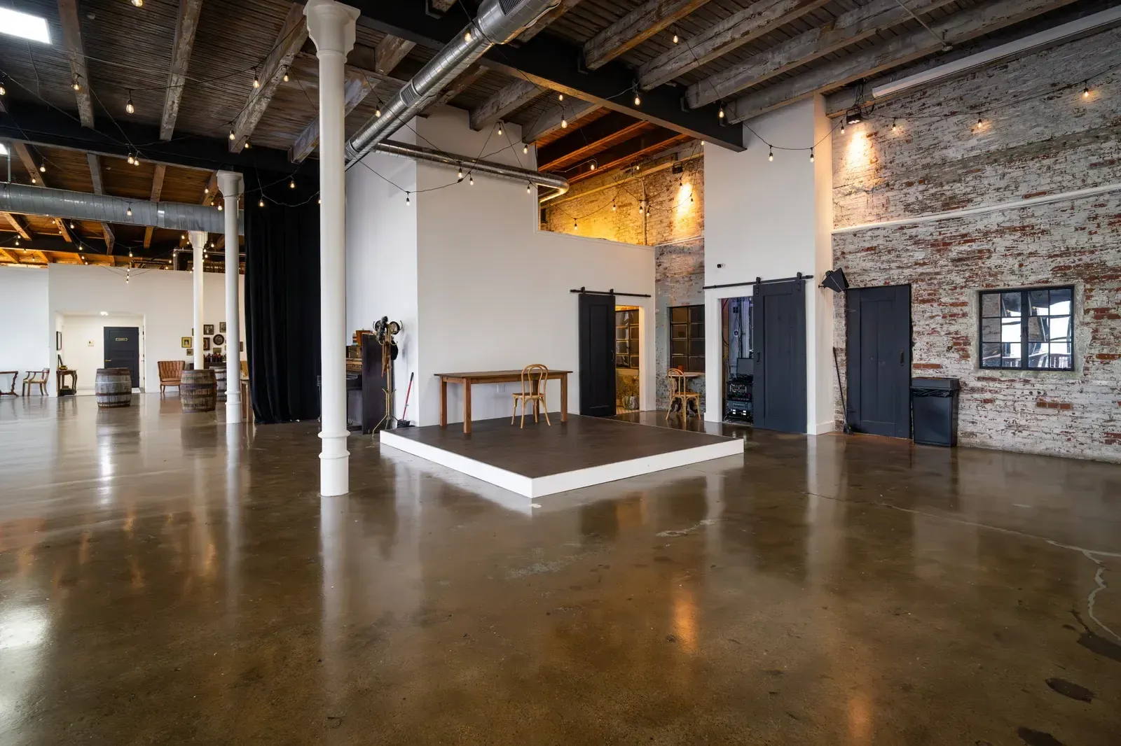 The raised stage in the Edison Room at 24 Shelby, where a jazz trio or big band sets up for a company holiday party in downtown Indianapolis