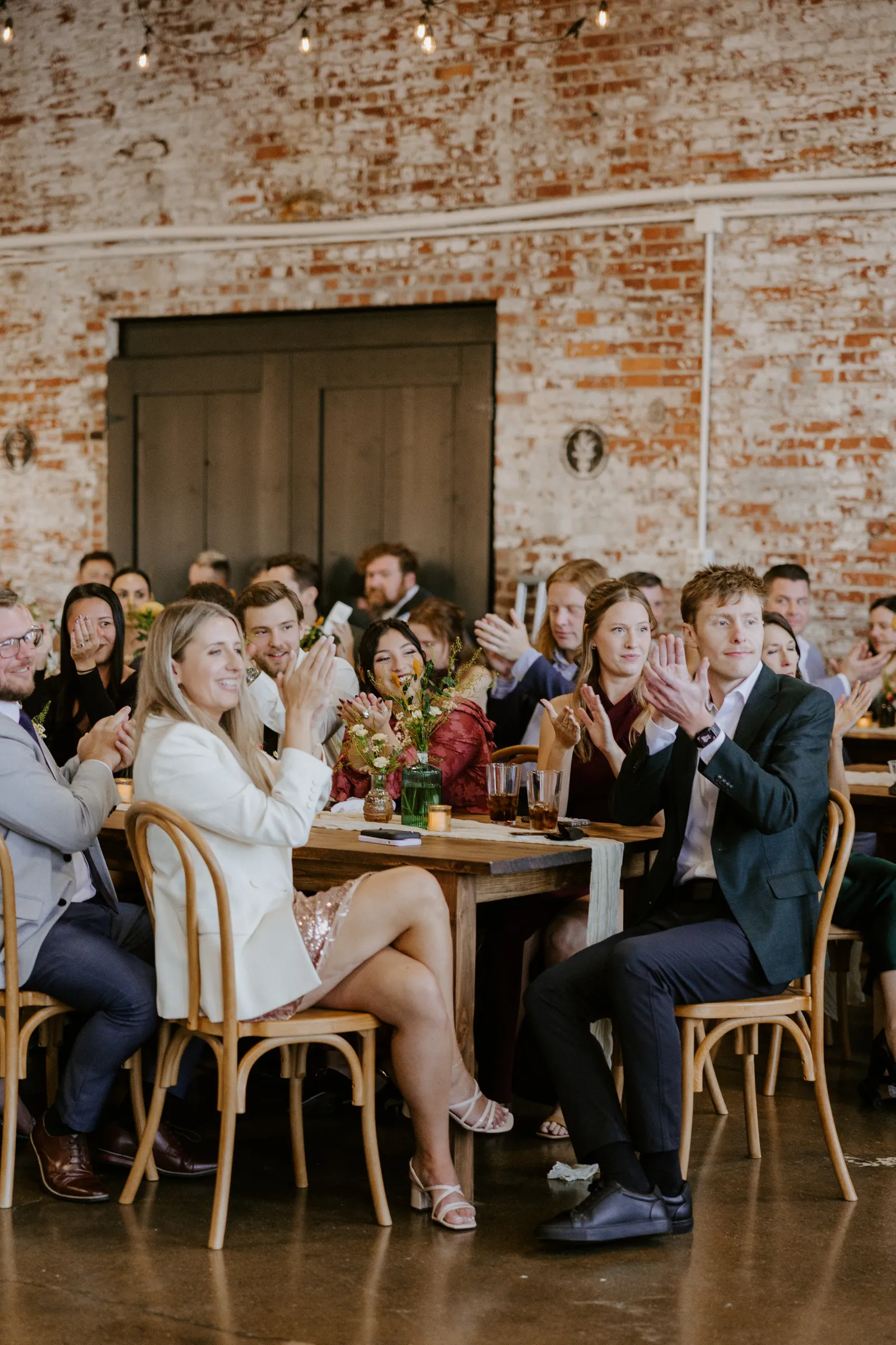 Celebration at 24 Shelby with guests toasting in the Edison Room